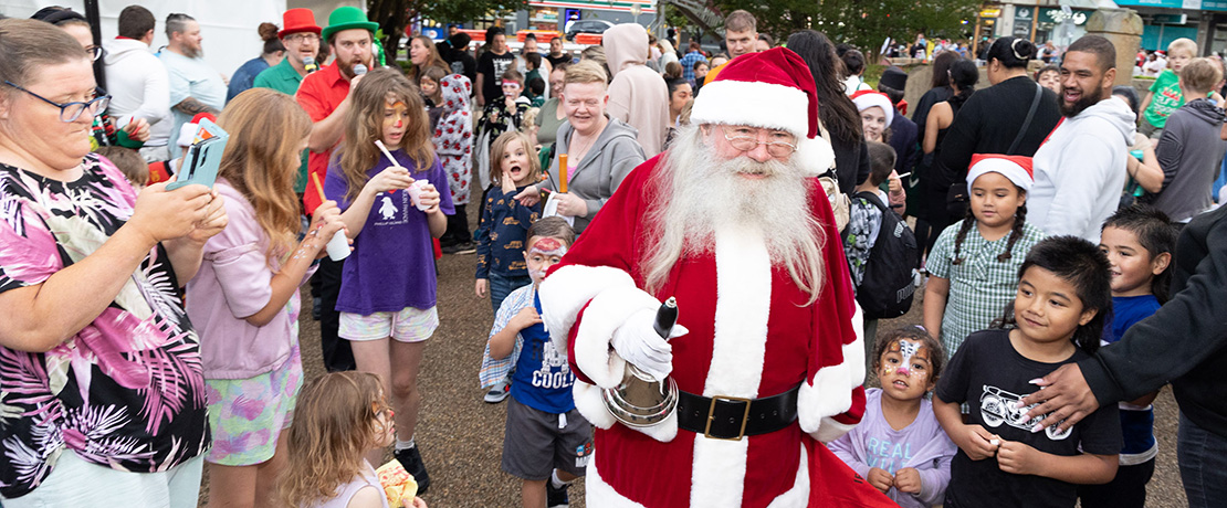 Santa and residents walking through Campbelltown