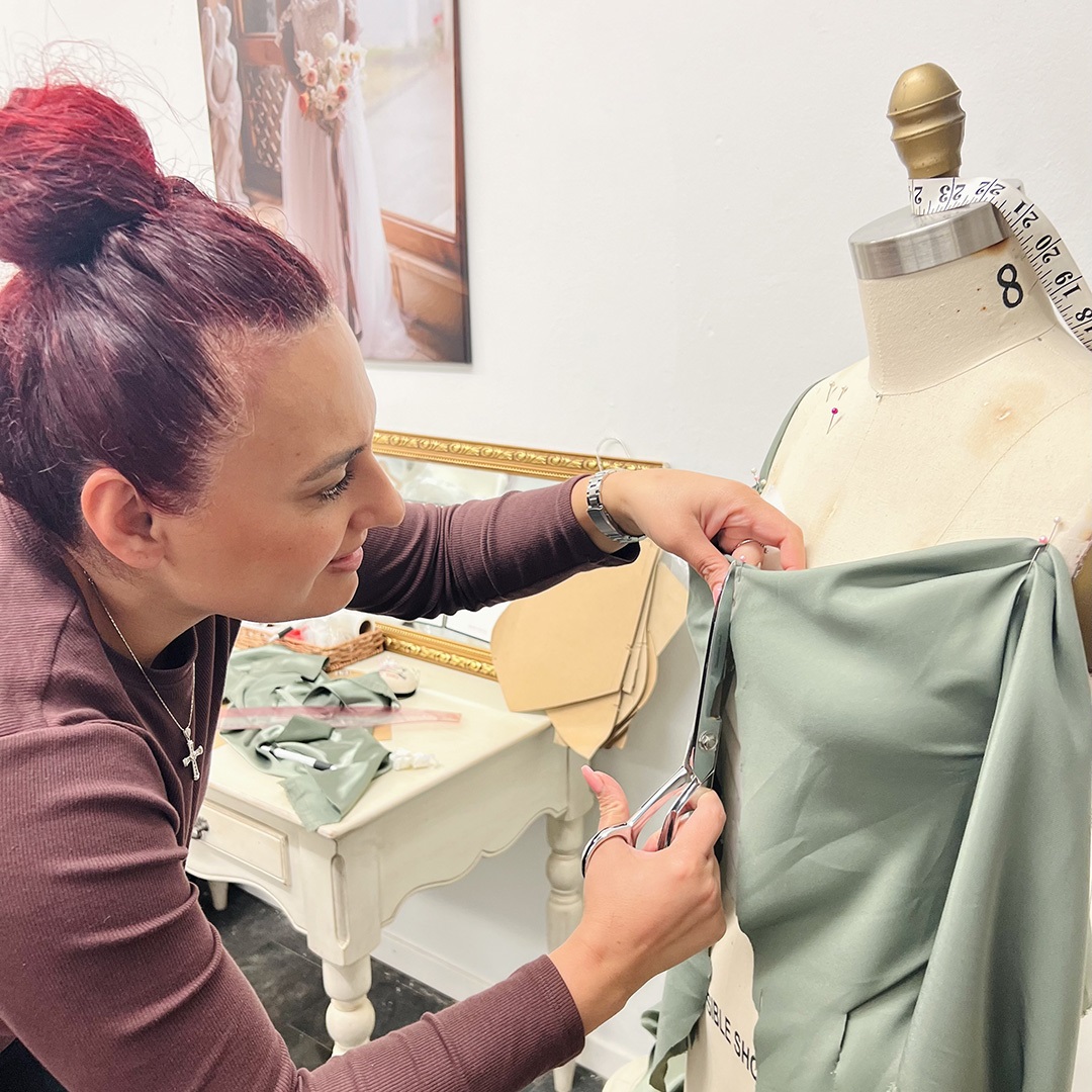 Artist Eileen working on a garment