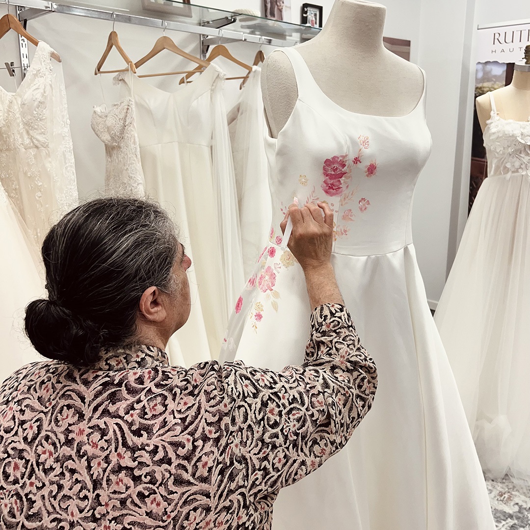 Artist Lydia Fattal working on a design on a dress