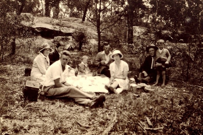 A family enjoying a picnic in bushland 