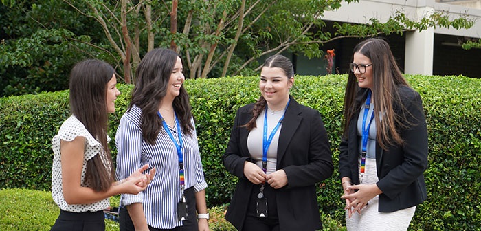 Council trainees smiling and having a conversation