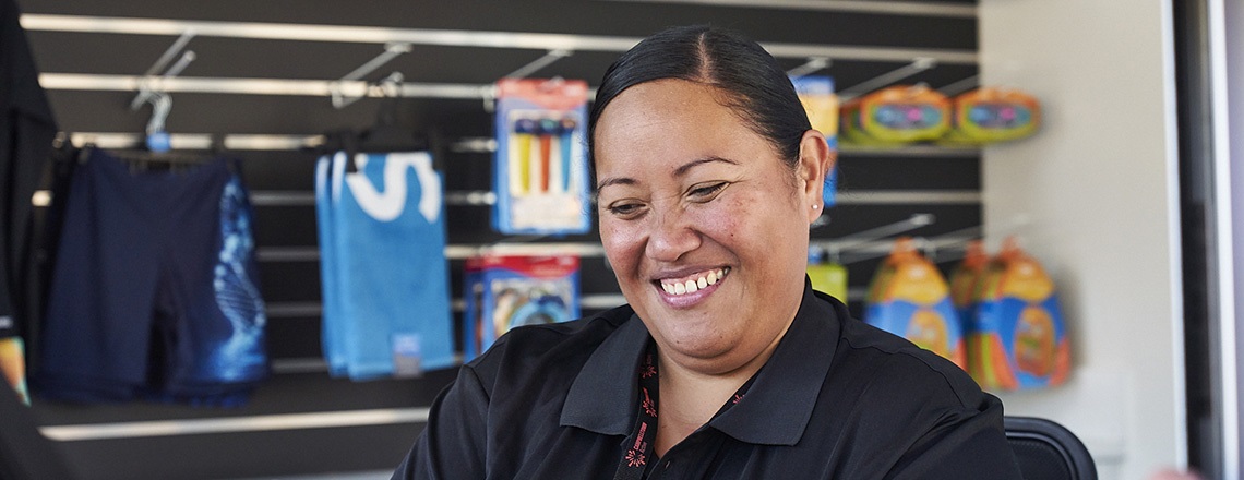 A staff member at the reception of the Billabong