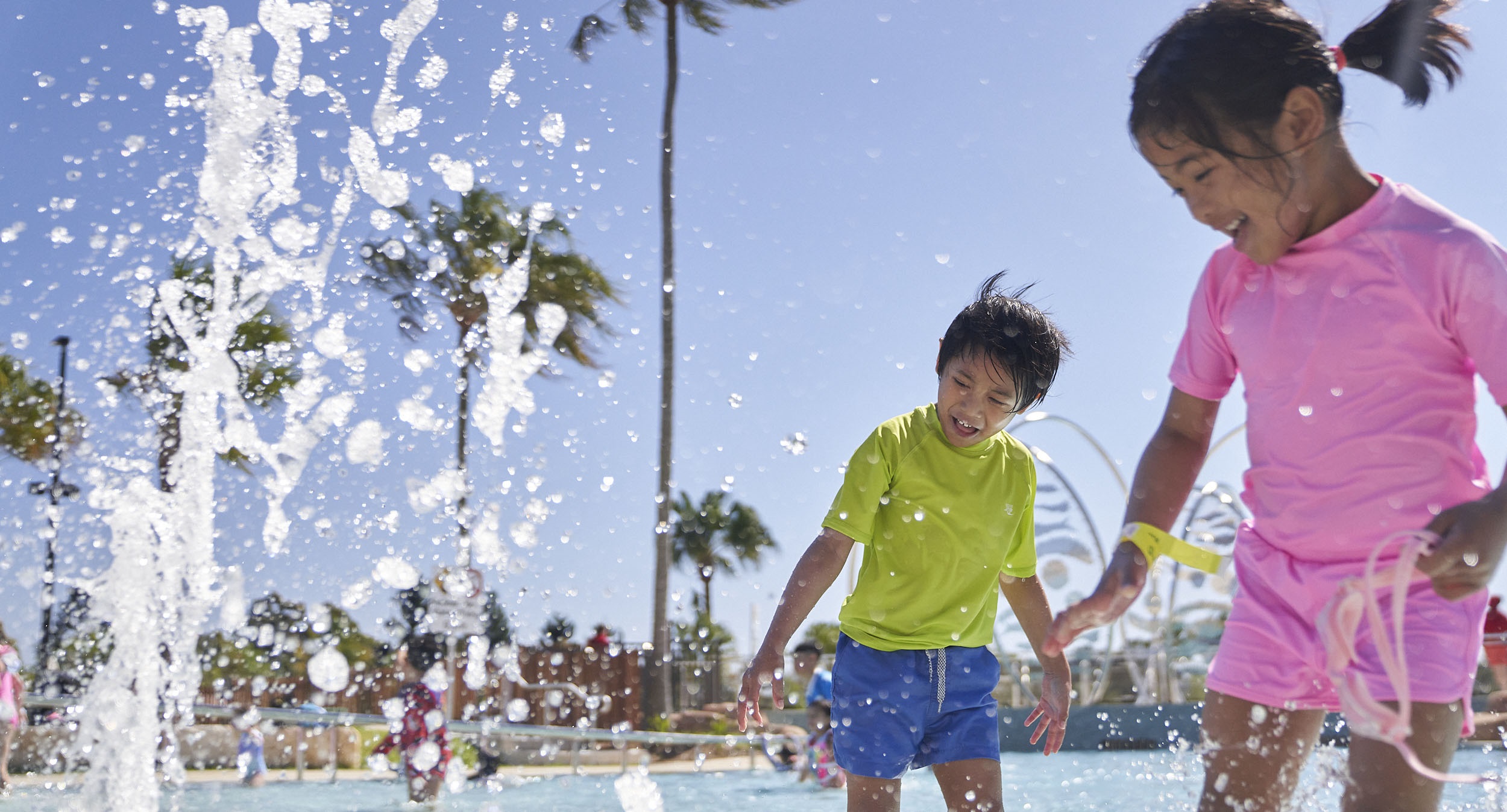 Two children playing in the Billabong Parklands splash park