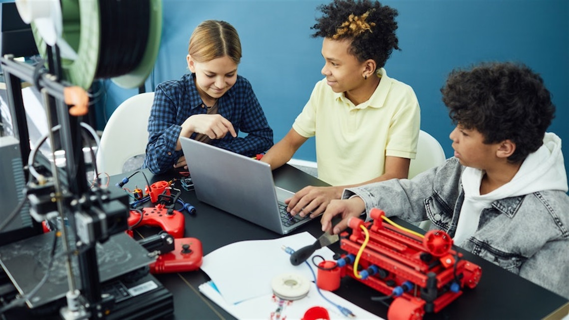 Kids using 3D printer