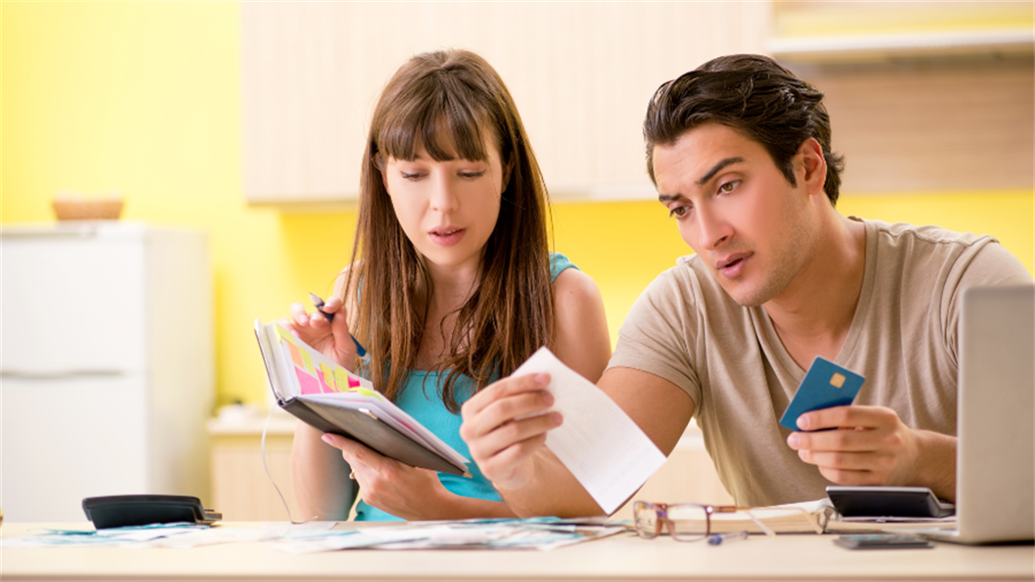 Two people doing paperwork