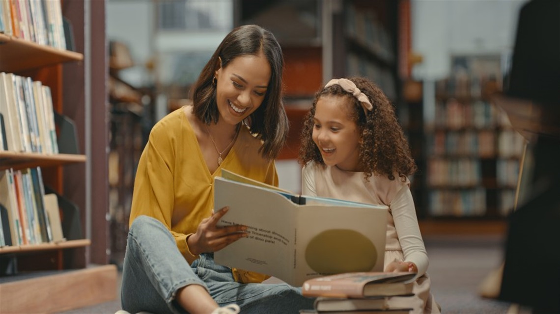 Mum and daughter reading together